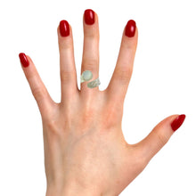 Load image into Gallery viewer, A hand with red painted nails wearing a chunky sterling silver ring with a faceted moonstone gem