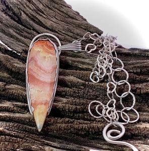 lace agate pendant in natural setting