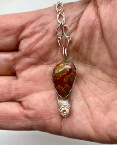 pendant shown in hand for sizing