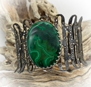 malachite steel and silver cuff on natural background