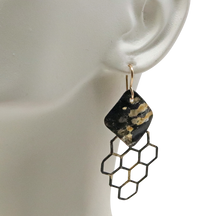 Load image into Gallery viewer, golden steel earrings on lobe