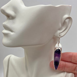 handmade amethyst earrings on lobe