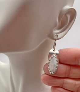 moonstone earring shown on ear lobe