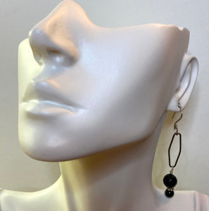 onyx earring shown on ear lobe