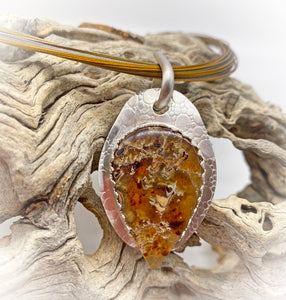 Indonesian amber pendant in natural setting