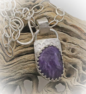 charoite pendant in natural background