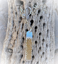 Load image into Gallery viewer, druzy pendant shown on natural cactus
