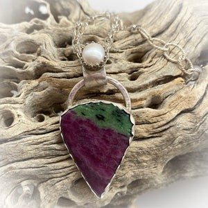 ruby zoisite pendant in natural setting