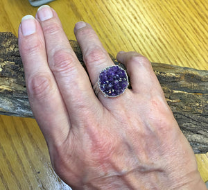 view on a hand of the handmade amethyst geode ring