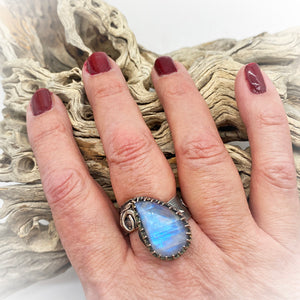 aantiqued moonstone ring shown on hand